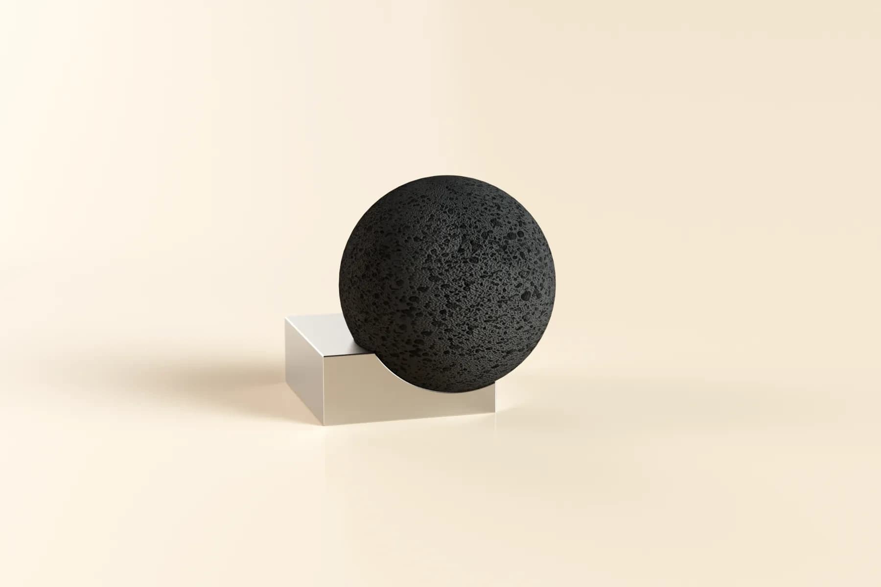 Mordeco Moon Rock Diffuser, black volcanic stone sphere on a silver metal base, cream background hero shot
